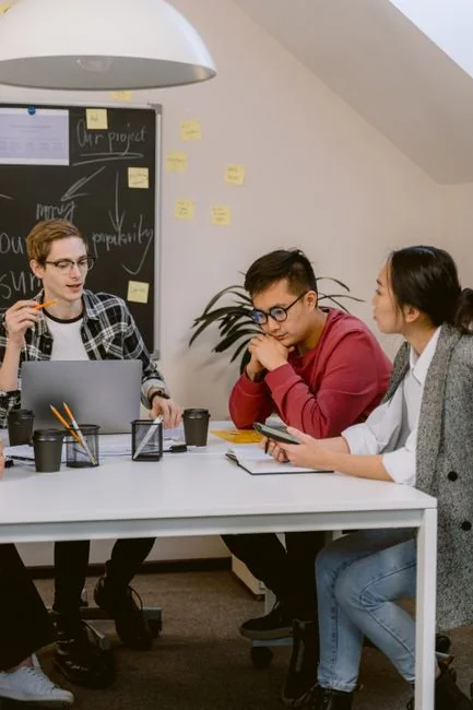 Man analyzing marketing content strategies using sticky notes on a whiteboard.